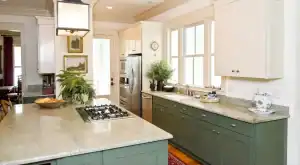 Modern kitchen with green cabinets, stainless steel appliances, and large windows for bright, airy s.